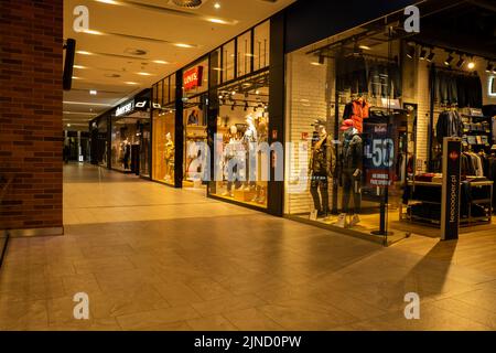 Gdansk Poland - April 2022. Forum gallery shopping mall view of the interior of the building at night. Modern shopping and entertainment centre. Architecture in the city center of Gdansk is the historical capital  Stock Photo