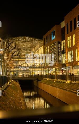 Gdansk Poland - April 2022. Forum gallery shopping mall at night. Modern shopping and entertainment centre. Architecture in the city center of Gdansk is the historical capital of Polish Pomerania with medieval old town architecture Stock Photo