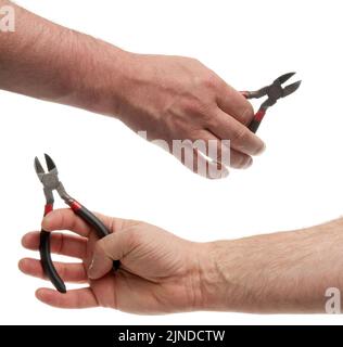 Side wire cutters in hand. Isolated on white background with clipping path Stock Photo
