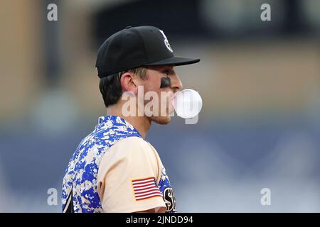 August 10, 2022: Biloxi Shuckers infielder Cam Devanney (4) enjoys his bubble gum during an MiLB game between the Biloxi Shuckers and Rocket City Trash Pandas at MGM Park in Biloxi, Mississippi. Bobby McDuffie/CSM Stock Photo