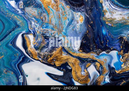 Luxury abstract fluid art painting background. Spilled blue, white and gold acrylic paint. Stock Photo