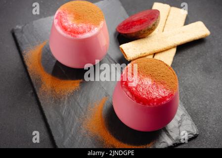Two cups of beet latte on a dark background. Healthy eating alternative to caffeine Stock Photo
