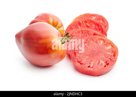 Sliced bull heart tomatoes isolated on white background. Stock Photo