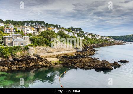 View up the River Fowey towards the town of Fowey in Cornwall. The large house on the left is Point Neptune House, recently owned by Dawn French. Stock Photo