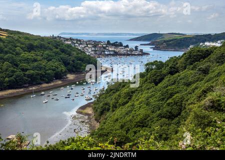 Elevated view of the Fowey estuary and the coastal village of Polruan and its harbour in Cornwall. Pont Pill provides a natural harbour for boats. Stock Photo