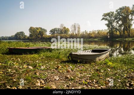 Wooden boats pulled to the shore of the National Park - Sodros in autumn. Stock Photo