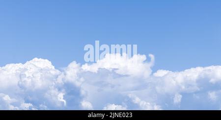 Clear blue sky and beautiful white clouds. Summer season. Cumulus cloud, natural background. Panoramic cloudscape. Abstract wallpaper, heaven pattern. Stock Photo