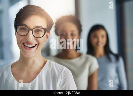 Happy, professional business woman and hiring team welcoming new recruits and employees to the office. Portrait of female leader and HR manager Stock Photo