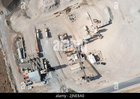 A concrete mixing plant (left) and an asphalt batchmix plant (right) in Spanish Valley, near Moab, Utah. Stock Photo