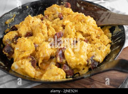 Chorizo with fried eggs in a pan Stock Photo