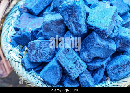 Blue indigo color stones displayed at traditional souk - street market in Marrakech, Morocco, closeup detail Stock Photo