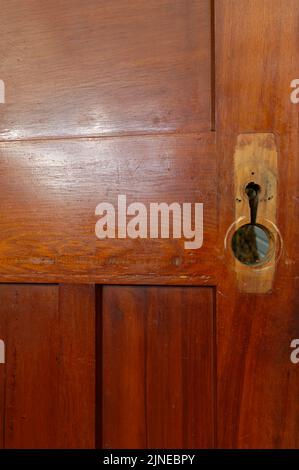 A door is being renovated, it has had its door handle removed during this process Stock Photo
