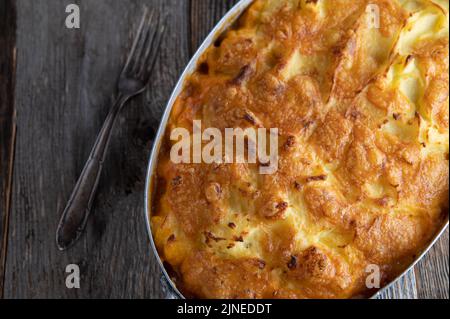 Shepherds pie closed in a casserole dish with cheese potato crust Stock Photo