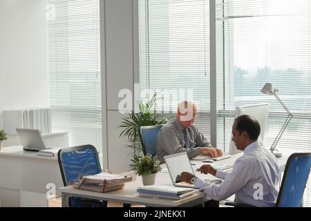 Professional financial managers working in modern office Stock Photo