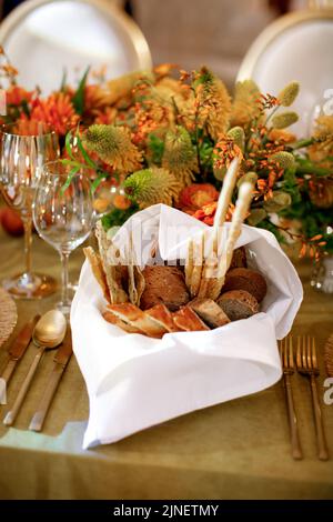 Different types of bread on the wedding table. Stock Photo