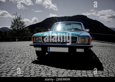 A vintage Mercedes-Benz parked outside on a sunny day Stock Photo