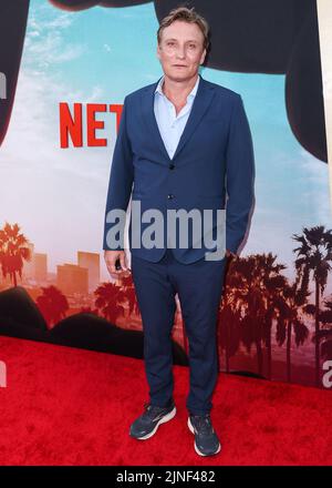 Los Angeles, United States. 10th Aug, 2022. LOS ANGELES, CALIFORNIA, USA - AUGUST 10: German actor Oliver Masucci arrives at the World Premiere Of Netflix's 'Day Shift' held at Regal Cinemas LA Live Stadium 14 on August 10, 2022 in Los Angeles, California, United States. (Photo by Xavier Collin/Image Press Agency) Credit: Image Press Agency/Alamy Live News Stock Photo