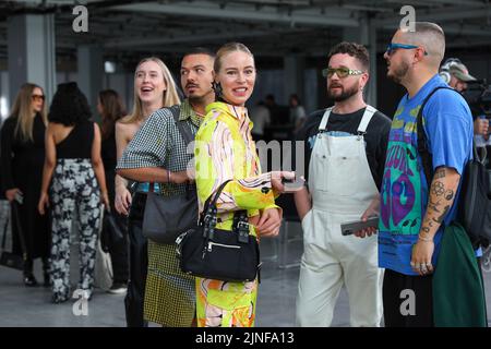 Copenhagen, Denmark. 10th Aug, 2022. Guests chatting after the Copenhagen Fashion Week SS 2023 Fashion event showcasing the Iso. Poetism brand in Scandinavia. Copenhagen Fashion Week is the main fashion event in Scandinavia. Copenhagen Fashion Week SS 2023 runs from 9 to 12 August 2022 this summer. (Photo by Takimoto Marina/SOPA Images/Sipa USA) Credit: Sipa USA/Alamy Live News Stock Photo