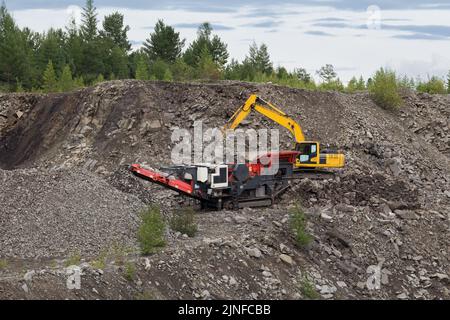 Mobile Stone Crusher Machine By The Construction Site Or Mining Quarry For  Crushing Old Concrete Slabs Into Gravel And Subsequent Cement Production.  Stock Photo, Picture and Royalty Free Image. Image 130474849.