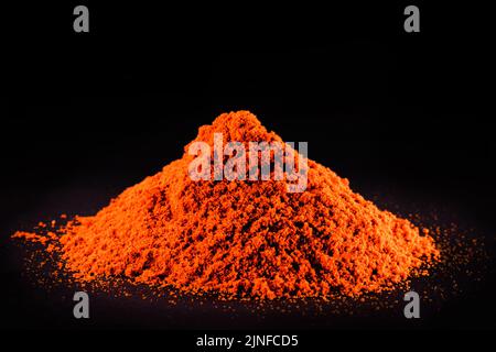 red pigment used as a dye in the textile industry, dyes and synthetic fabrics, copyspace Stock Photo