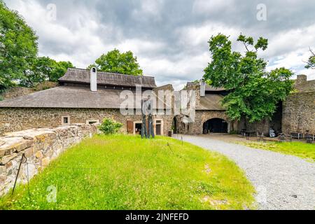 Medieval castle Helfstyn, Czech Republic. Ancient castle in gothic style. Castle walls and interiors, beautiful old tower. Summer weather, blue sky wi Stock Photo