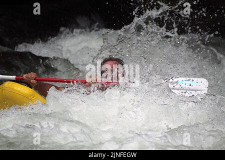 A man kayaking in stormy Nantahala River in Cartoogechaye, North Carolina Stock Photo