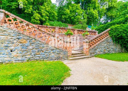 Lysice castle, Czech Republic. Famous baroque castle built in 14th century. Beautiful formal garden, palm trees and flowers. Promenade near the castle Stock Photo