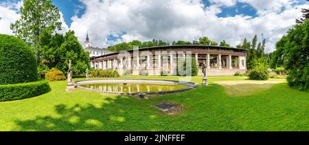 Lysice castle, Czech Republic. Famous baroque castle built in 14th century. Beautiful formal garden, palm trees and flowers. Promenade near the castle Stock Photo