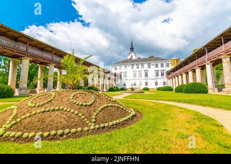 Lysice castle, Czech Republic. Famous baroque castle built in 14th century. Beautiful formal garden, palm trees and flowers. Promenade near the castle Stock Photo