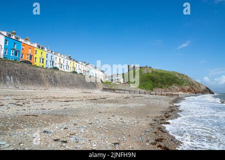 Criccieth castle and marine terrace seen from the beach on the coast of Gwynedd, North Wales. Stock Photo