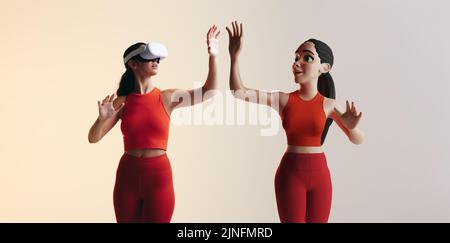 Getting into the metaverse. sporty young woman playing virtual reality games as a 3D avatar. Young woman interacting with immersive technology using a Stock Photo