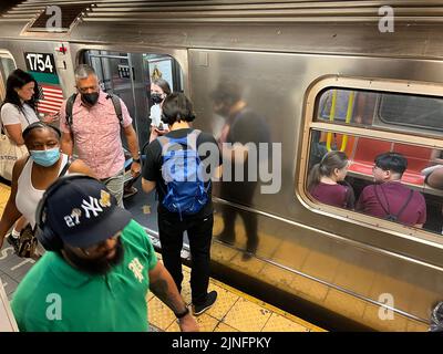 Riders exit an F train at the Broadway Lafayette station in the SOHO neighborhood in New York City. Stock Photo