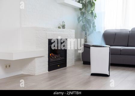 White Air purifier in living room for fresh air and healthy life. Copy space Stock Photo