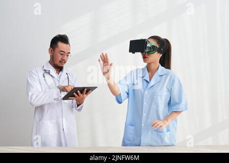 Medical team trying new virtual reality application Stock Photo