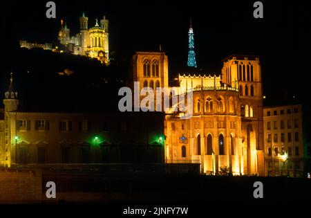 Lyon France City at night - Lyon Cathedral overlooked by Basilica Of Notre-Dame de Fourviere and Tour Metallique de Fourviere Stock Photo
