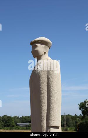 Regiment of Trees, stone soldiers carved by Patrick Walls stand in a grid, Langley Vale Centenary Wood, Epsom, Surrey, England, UK, July 2022 Stock Photo