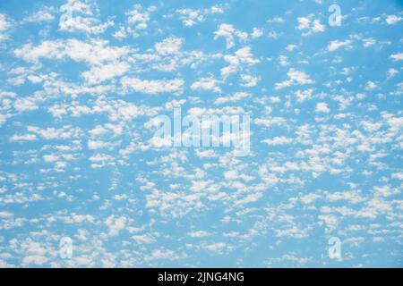 Summer blue sky cloud light white background. Texture white clouds on a blue Stock Photo