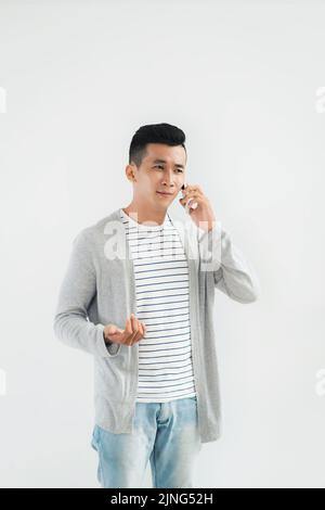 Portrait of young man discussing various issues on the phone Stock Photo