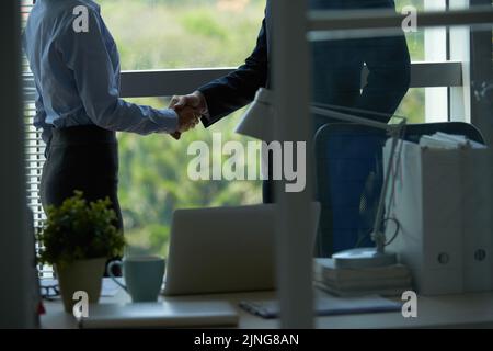Cropped image of business people shaking hands Stock Photo