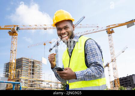 Excited Winner Construction Builder Worker Engineer Using Phone Stock Photo