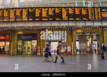 King's Cross railway station main concourse with train information. London, UK, 27th July 2022. Stock Photo