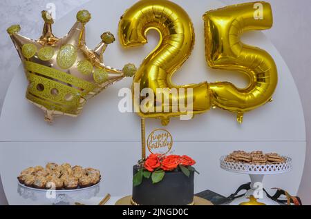 Gold foil balloon number, digit twenty-five. Birthday greeting card with inscription 25. Anniversary celebration event. Banner. Golden numeral, Stock Photo