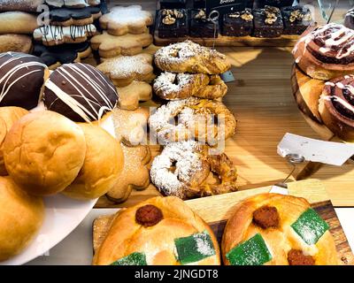 Mix of freshly baked pastries exposed in a bakary shop Stock Photo