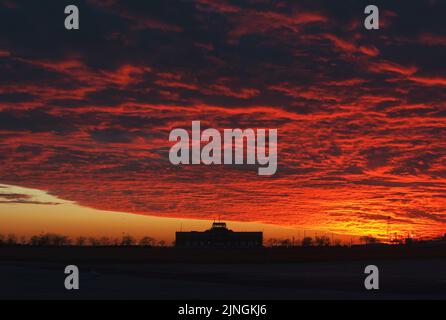 Ryan visitor center at Floyd Bennet Field with dramatic sunset clouds, Stock Photo