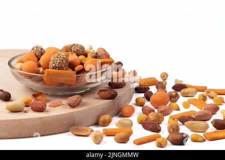 Mix of nuts isolated on bright background. Place for text. Close up view. Stock Photo