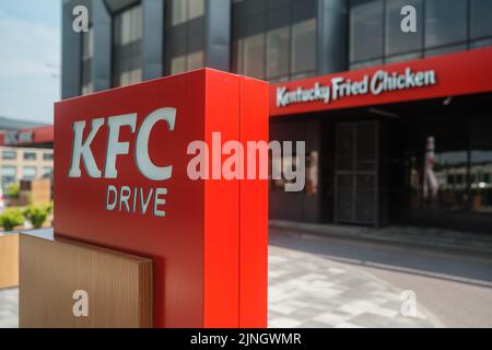 Kyiv, Ukraine - August 11, 2022: KFC drive thru sign at fast food restaurant Kentucky Fried Chicken Stock Photo