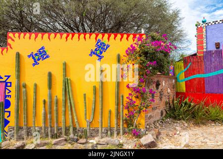 The colorful facade of American artist Anado McLauchlin home and studio called the Chapel of Jimmy Ray in his art compound Casa las Ranas in La Cieneguita, Mexico. Stock Photo