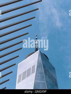 A low angle shot of One World Trade Center with the Oculus structure in the foreground Stock Photo