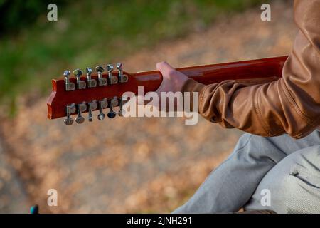 Musician playing acoustic guitar Stock Photo