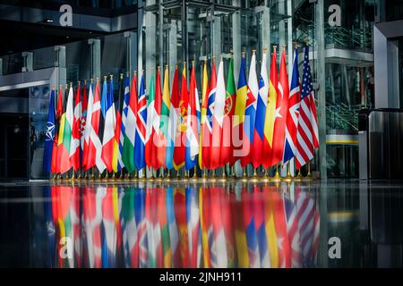 Brussels, Belgien. 04th Mar, 2022. Flags of the NATO member states are displayed at the NATO headquarters in Brussels. Brussels, 04.03.2022 Credit: dpa/Alamy Live News Stock Photo